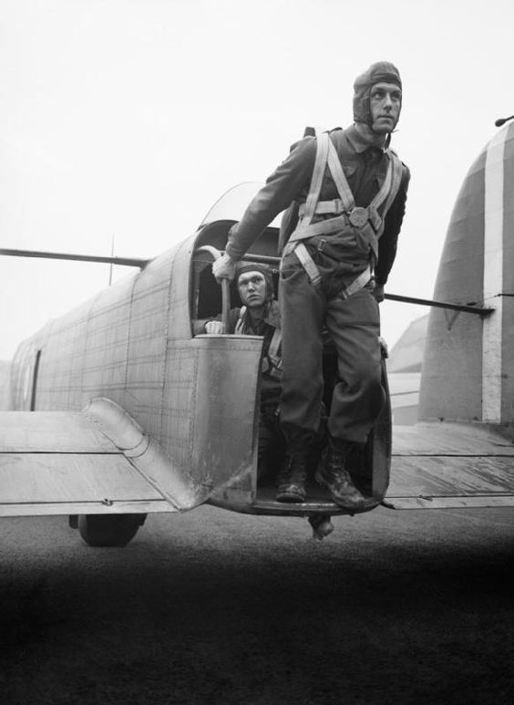 A parachute soldier demonstrates the exit point from a Whitley bomber tail. (Pinterest via iwm.org.uk)
