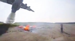 Plane Drops 11,000 Gallons Of Water On Fire, And Guy, and Cameraman