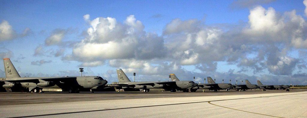 A row of B-52 Stratofortresses from Barksdale Air Force Base, La., and Minot AFB, N.D., await their next mission on the flightline Feb. 1 at Andersen AFB, Guam. The different colored tail markings represent the individual squadrons each bomber is assigned to at their home station. Approximately 300 Airmen from Barksdale AFB arrived on Guam recently as part of a scheduled rotation of bomber units into the Pacific theater.