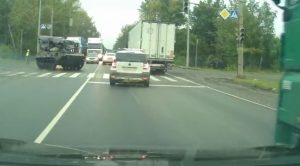 Dash Cam Captures Russian Tank From Convoy Spin Out, Smash Car