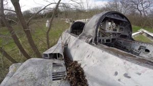 Abandoned F-14s and F-4 In A Field