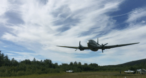C-46 Flies By Remote Alaskan Grass Strip