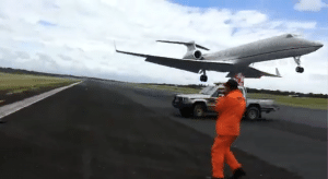 Plane Almost Hits Ground Crew Working On The Runway
