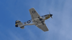 What Could Be Better Than the Sound of a P-51 Mustang? Two P-51s Flying By – WATCH