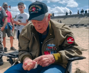 Watch the Emotional Moment WWII Veteran Reid Clanton Set Foot on Omaha Beach Again After 80 Years